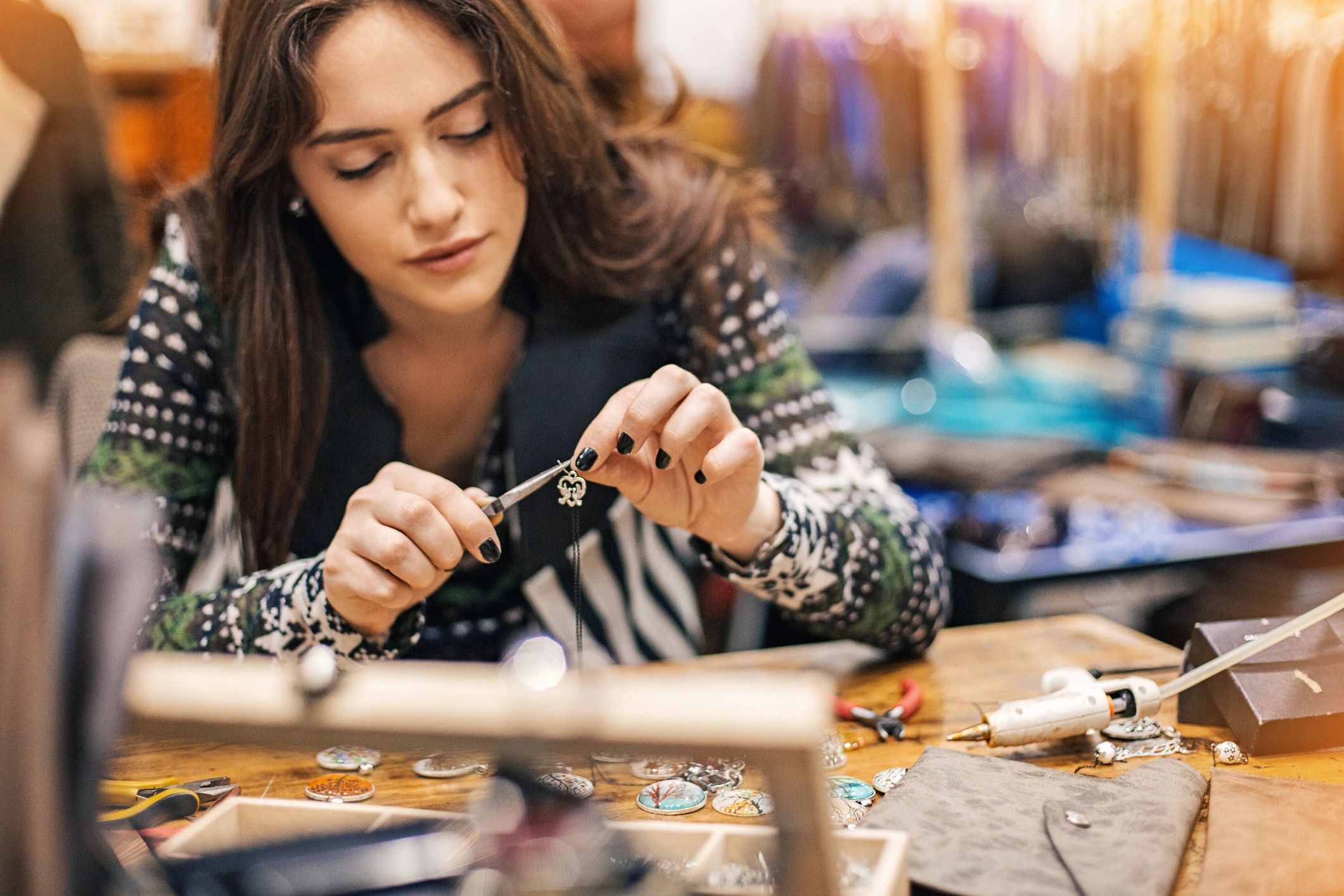 Jewelry artisan creating handmade pieces in a studio